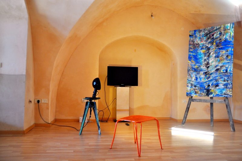 Works on easels in the artist's vaulted studio in Tzfat